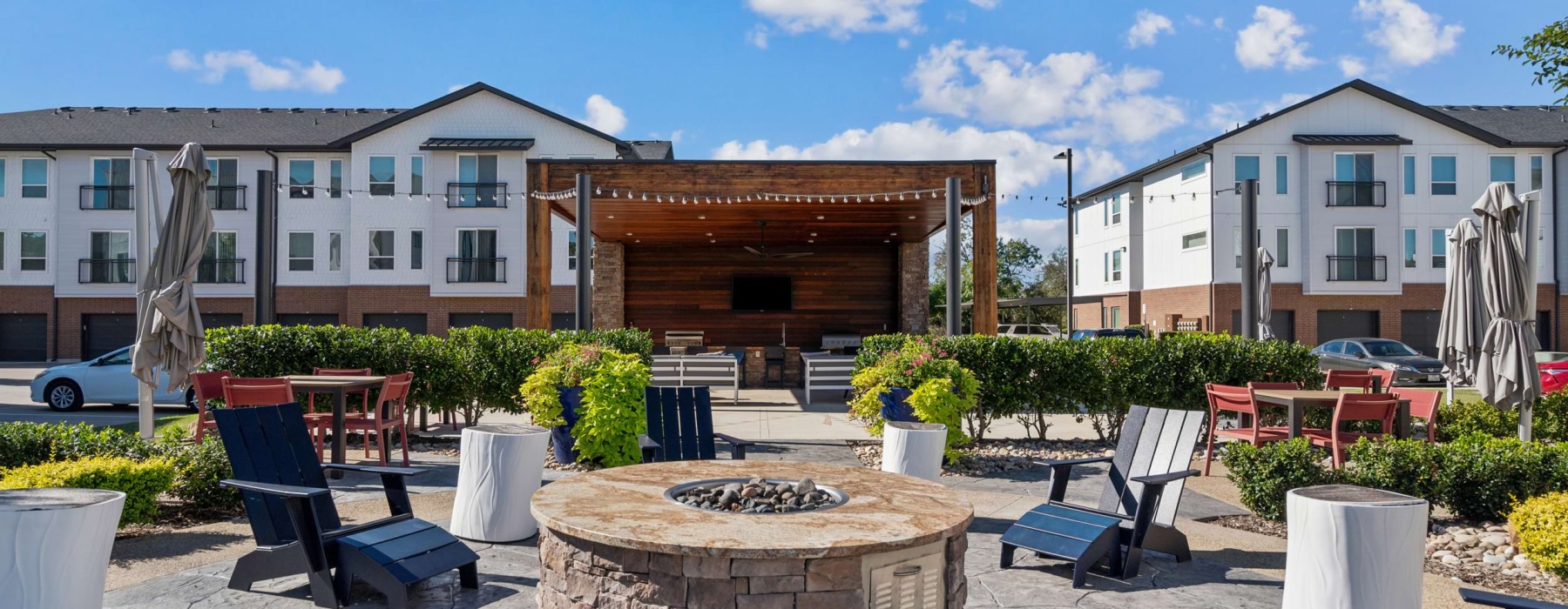 outdoor pavilion with an firepit and gathering area