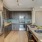Kitchen with a large eat-in bar and ample cabinet space