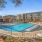Swimming pool in the round with lounge chairs