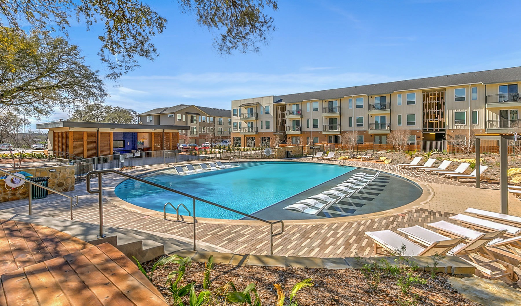 Swimming Pool in the round with lounge chairs Swimming Pool in the round with lounge chairs